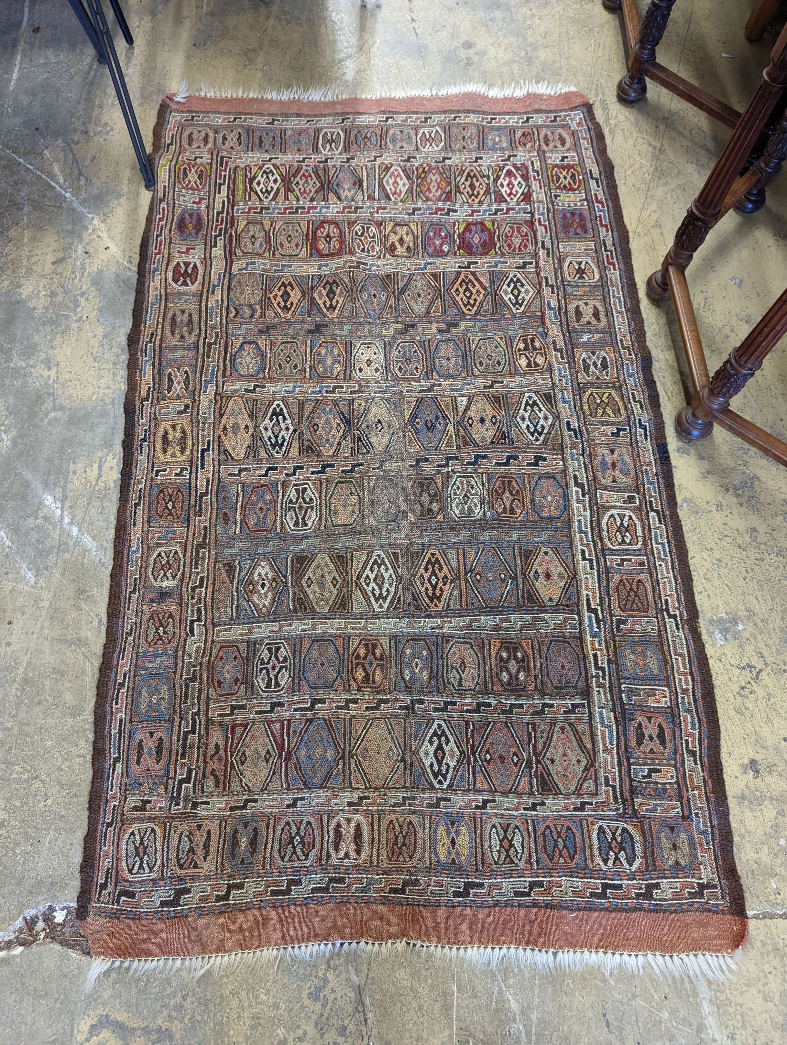 A Sumac flat weave polychrome rug, 180 x 108cm